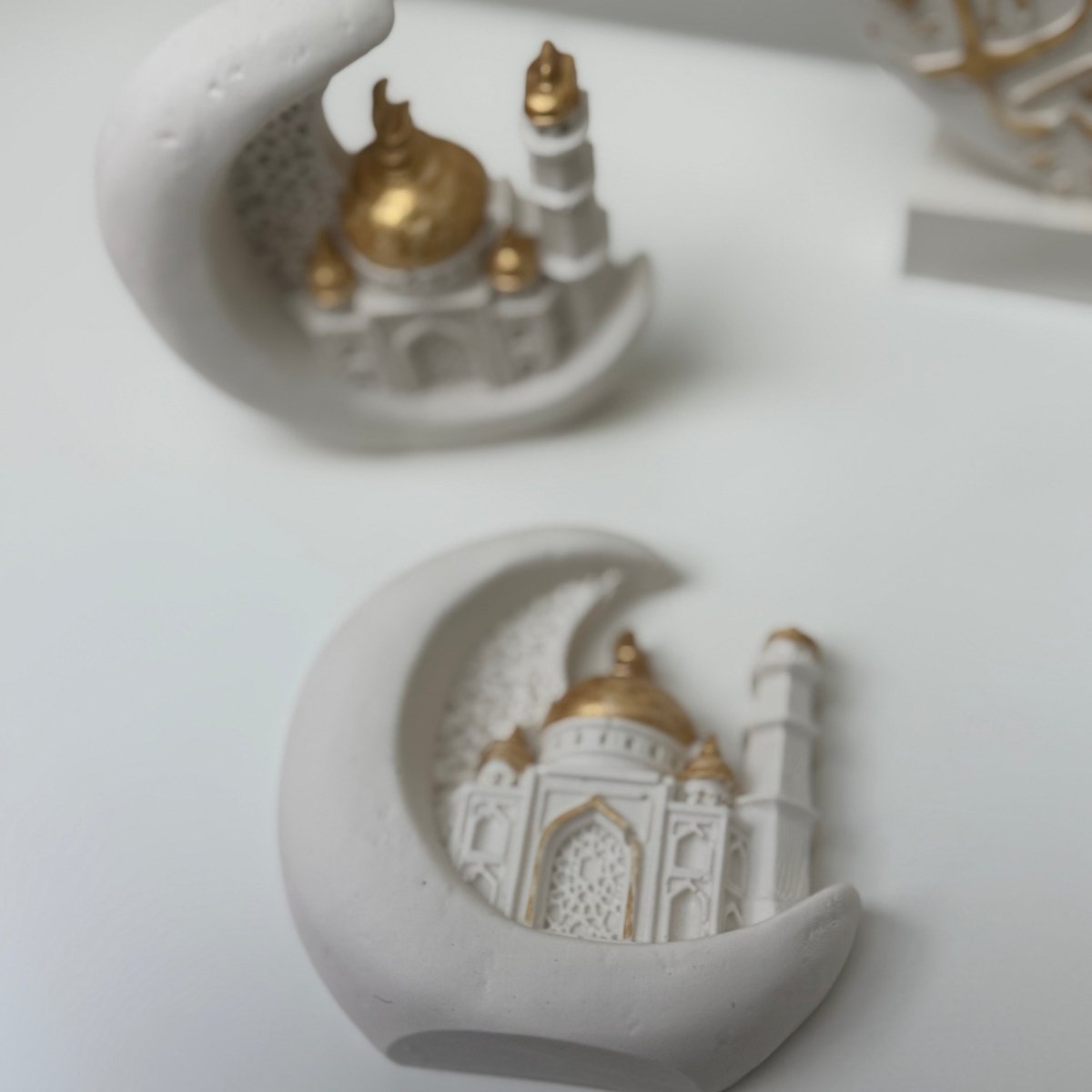Decorative items resembling the Taj Mahal on a white background