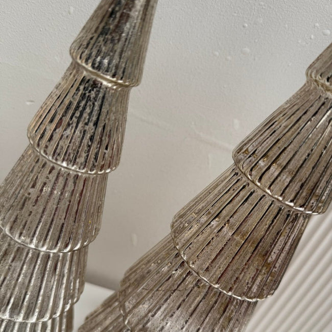 Close-up of metallic trees on a white background