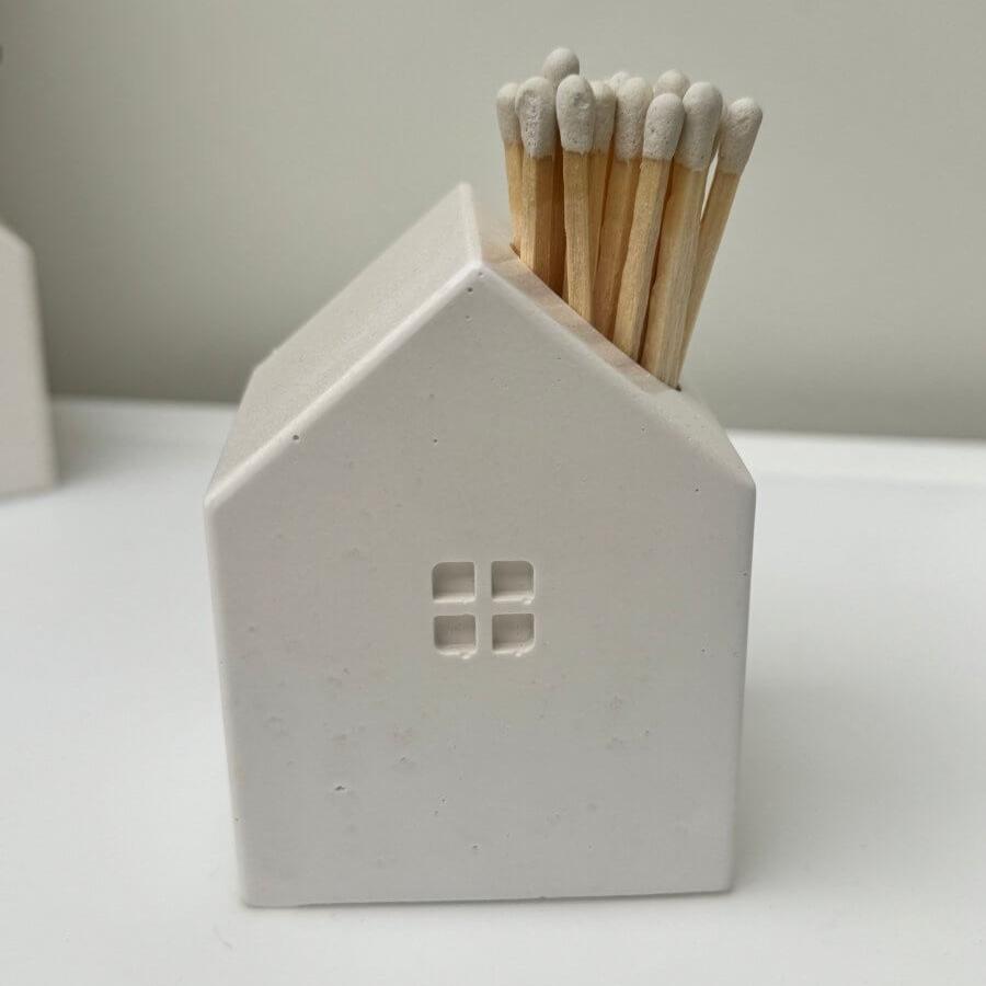 Stone house matchstick holder with white tipped matches