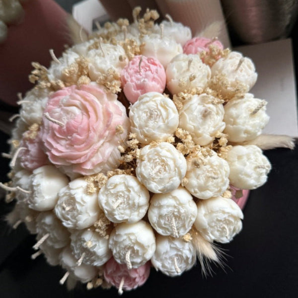 Bouquet of flowers with pink and white elements on a dark background