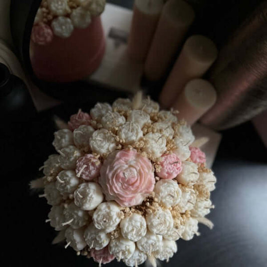 Decorative flower arrangement with pink and white flowers.