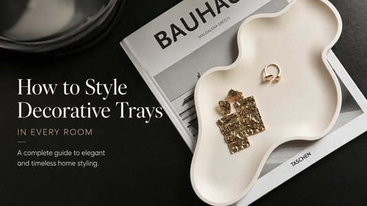 Handcrafted eco-stone decorative tray styled with jewellery on a coffee table book, showcasing elegant minimalist home décor inspiration.