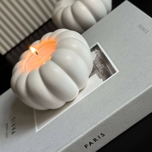 Stone Pumpkin tealight holder with lit candle