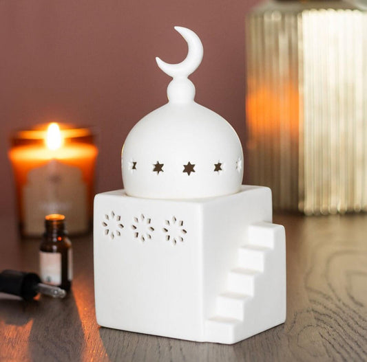 Ceramic Mosque Wax & Oil Burnerr with moon and star design on a wooden surface.