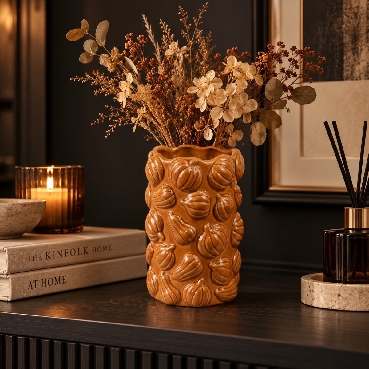 HARLOW orange pumpkin ceramic vase in a dark black and cream autumn home setting
