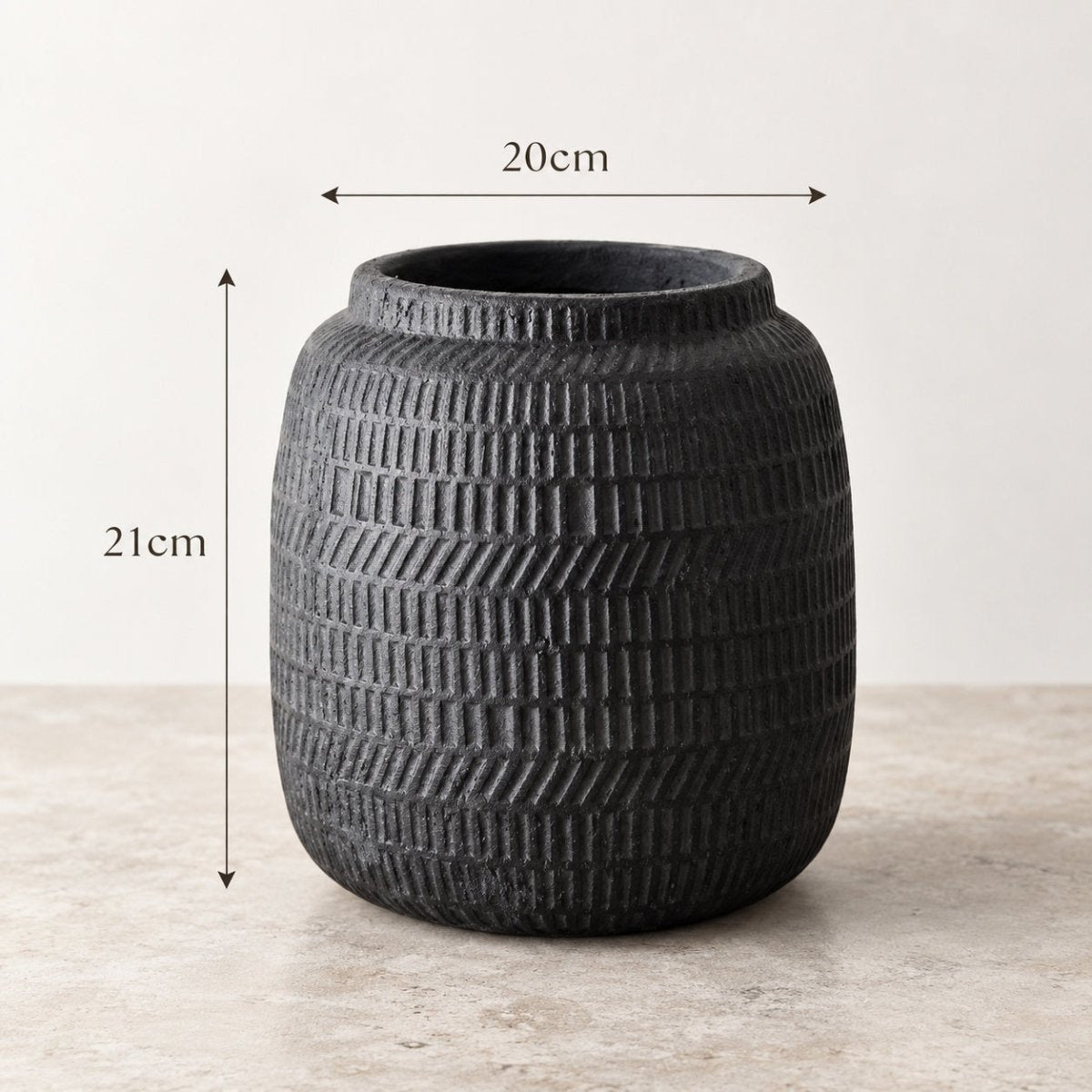 A dark charcoal textured ceramic decorative pot with a ribbed basketweave pattern, shown with dimension overlays indicating a height of 21cm and a width of 20cm.