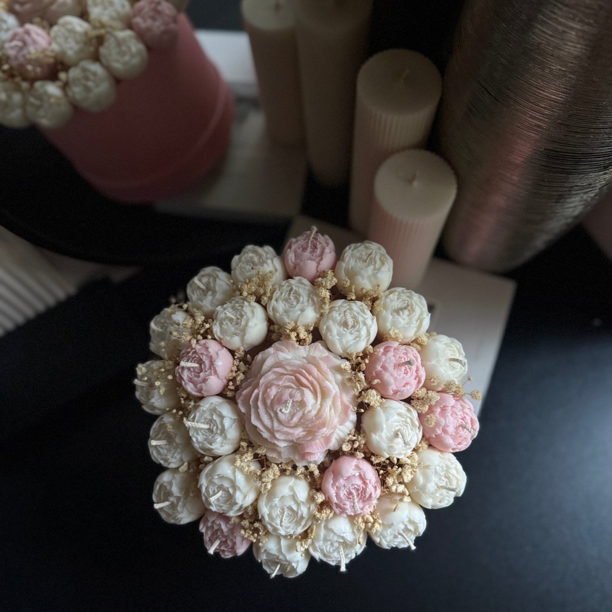 Large Flower candle bouquet on a dark surface