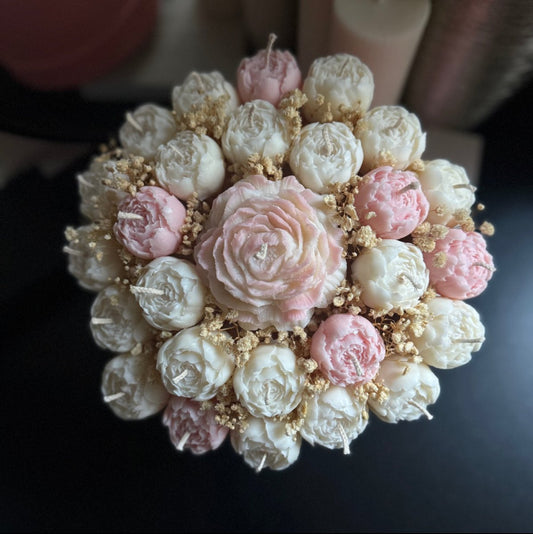 Large Flower candle bouquet on a dark surface.