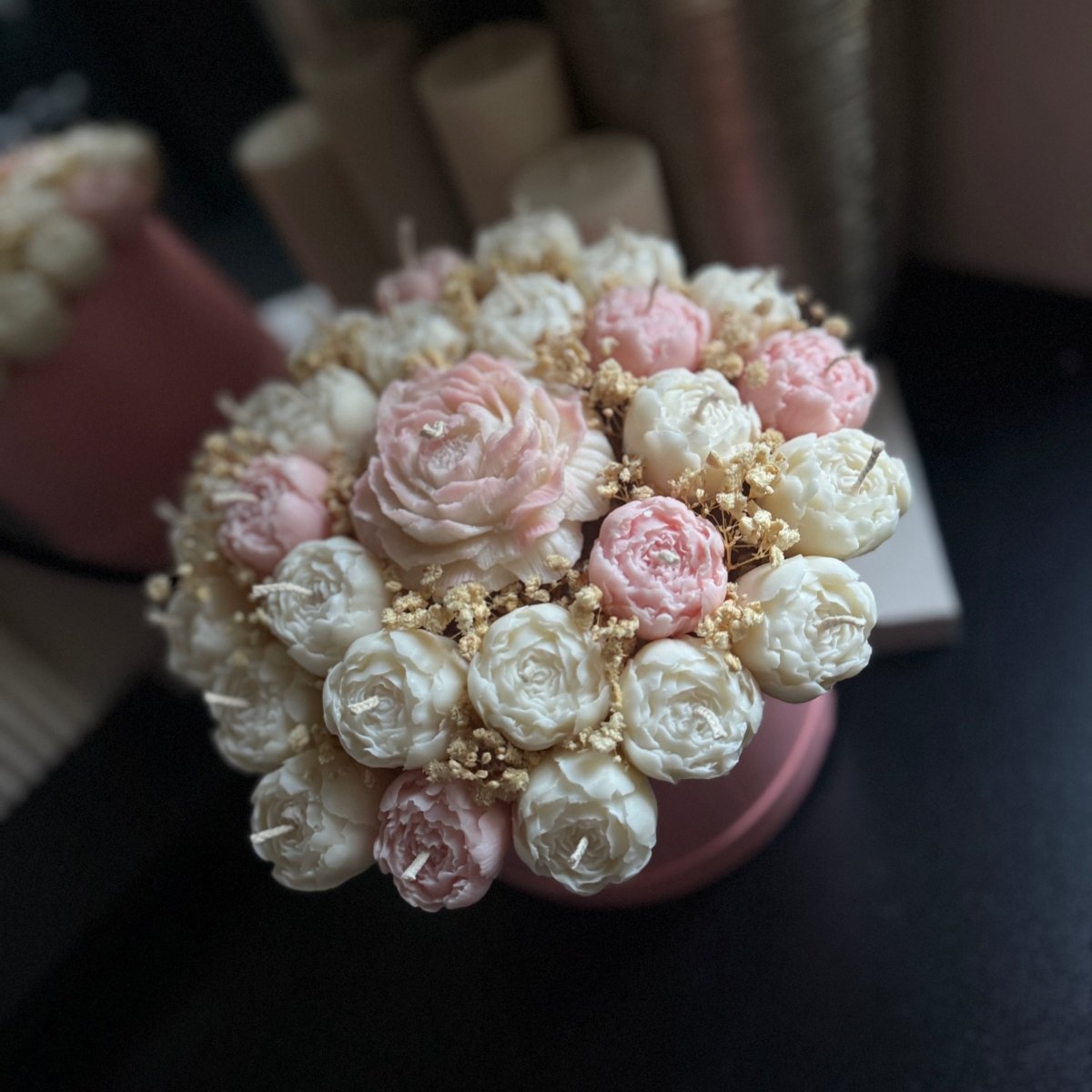 Large Flower candle bouquet on a dark surface