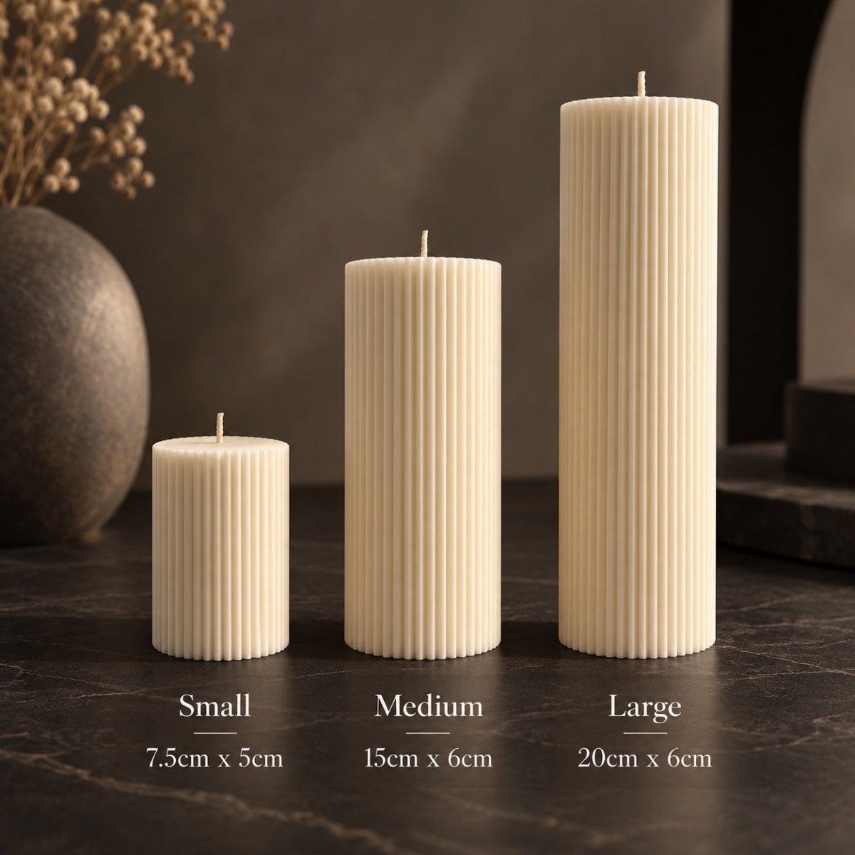 Three ribbed pillar candles in small, medium, and large sizes standing on a dark tabletop, with height and diameter labels overlaid below each candle.
