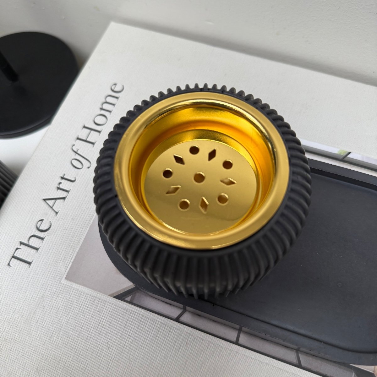 Modern stone bakhoor incense burner featuring a ribbed design and a gold-tone removable plate.