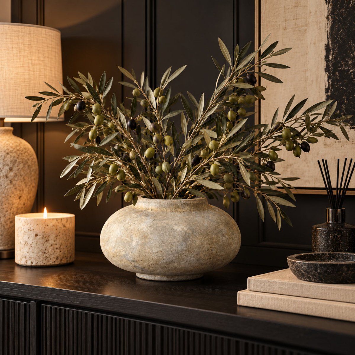 NARA rustic stone vase styled with olive branches in a modern black and cream interior