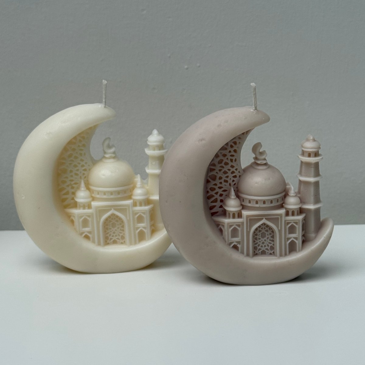 Decorative Candles resembling a mosque on a crescent moon against a gray background