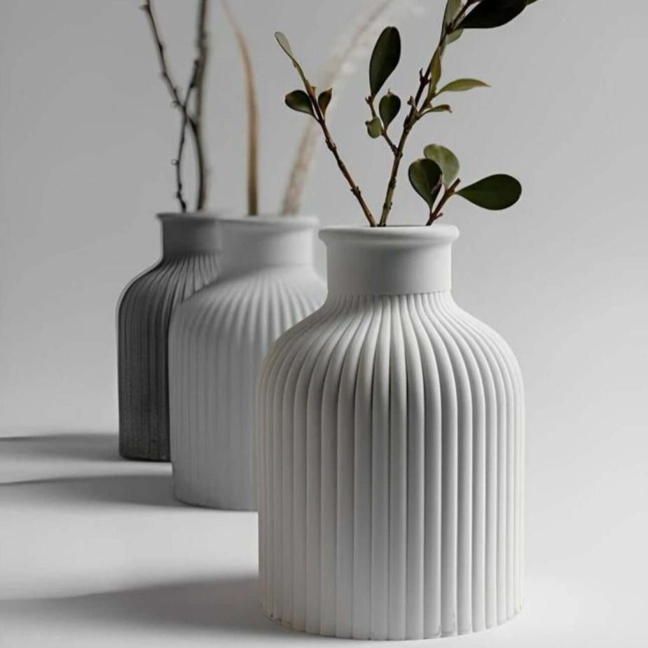minimalist SORA Stone Vases styled with elegant leaf stems