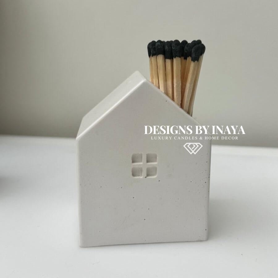 Stone house matchstick holder with black tipped matches