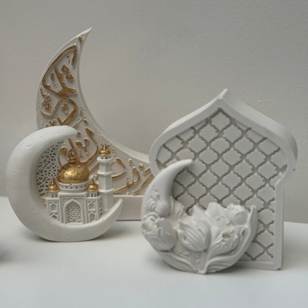 Decorative white ceramic piece with floral design on a light gray background
