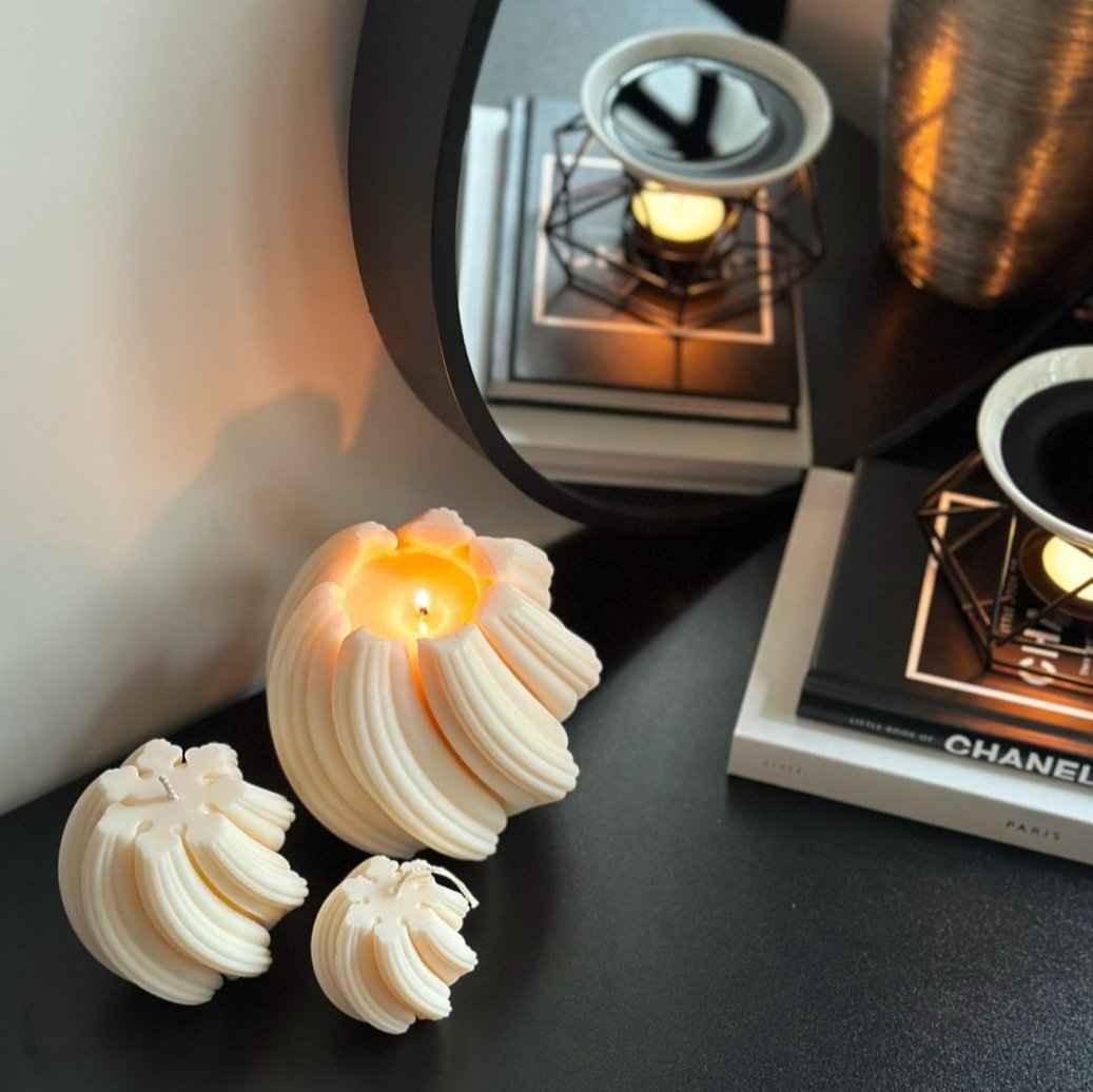 Sculptural candle styled on coffee table modern decor