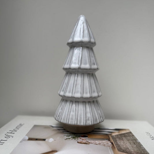 Decorative Christmas tree on a magazine with a plain background