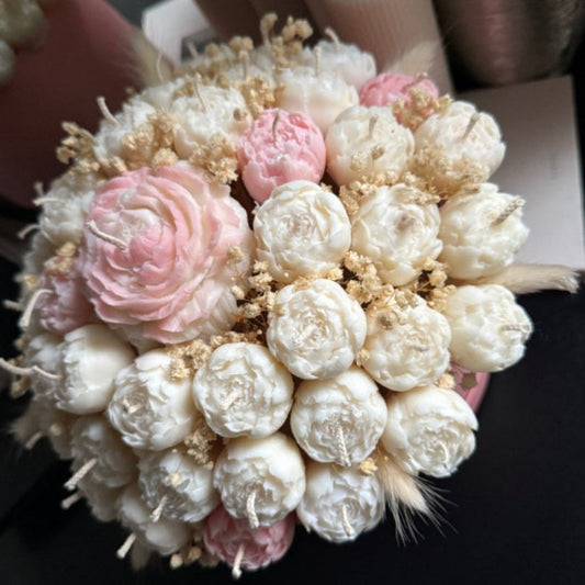 Bouquet of flowers with pink and white elements on a dark background
