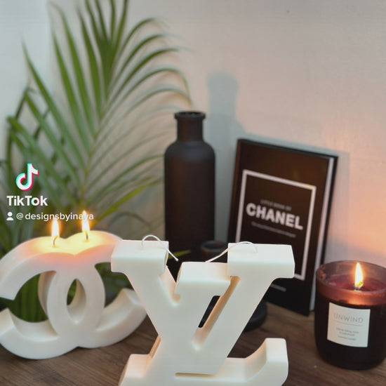Video of  large logo sculpture candles in cream